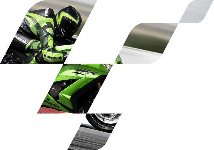 Une moto sportive Kawasaki verte, avec un pilote en tenue de course, qui accélère sur la piste, mettant en avant la vitesse, la maîtrise et les performances modernes dignes du MotoGP.