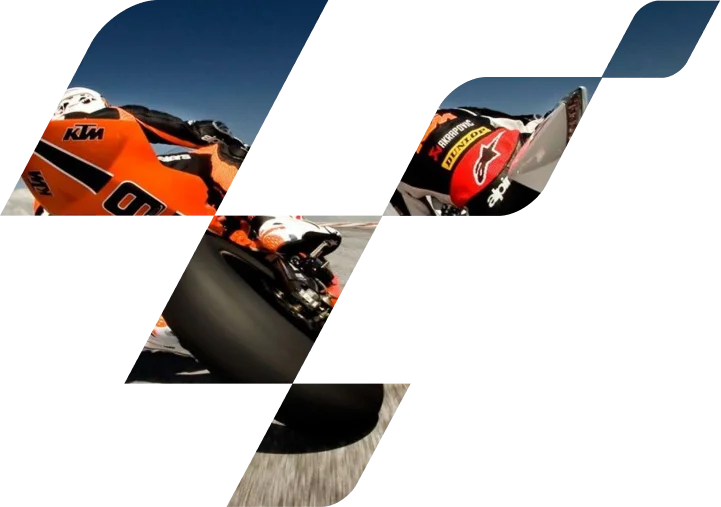 Deux motos de MotoGP roulant côte à côte, dont une KTM orange, illustrant l'intensité de la compétition et la vitesse lors d'une course professionnelle.